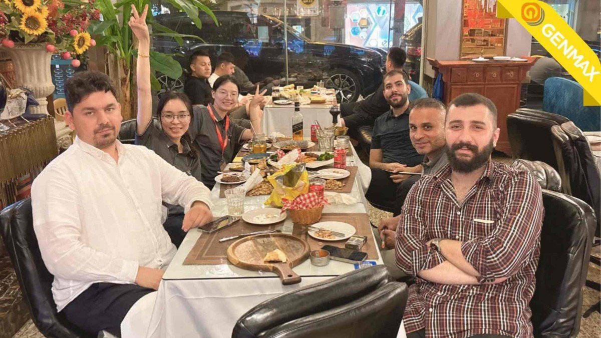 Engineering team sharing a business lunch with Iraqi guests after their tour of the sponge cutting machinery production facility.