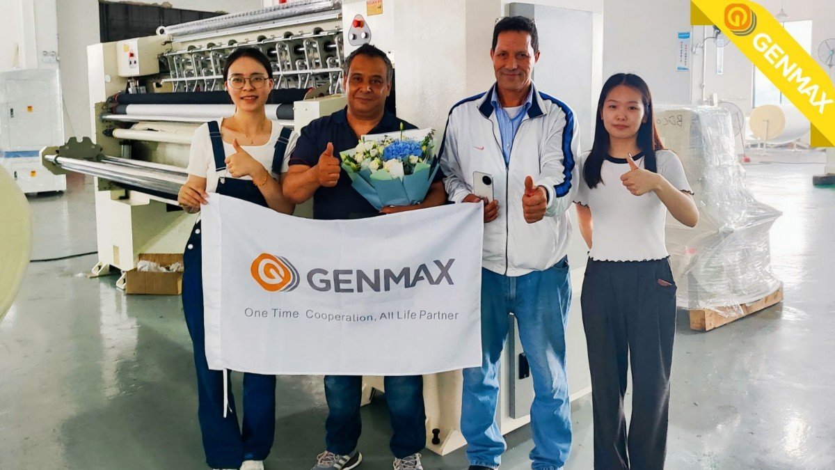 Genmax professional sales team demonstrating advanced quilting technology features to Moroccan customers at the manufacturing facility.