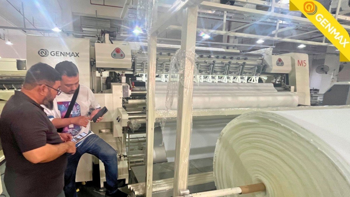 Technical specialists demonstrating quilting machine performance metrics to Saudi Arabian customers conducting thorough equipment assessment before finalizing their procurement decisions.