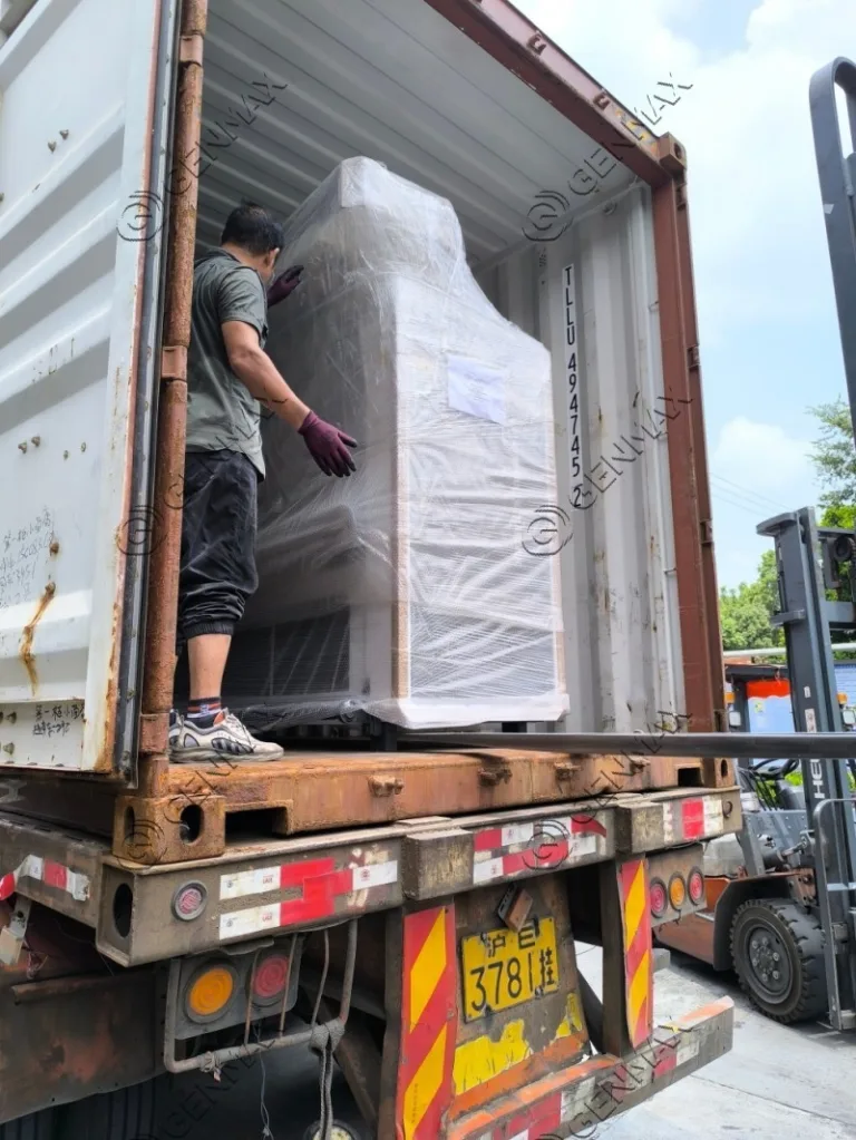 Commercial ultrasonic quilting machinery wrapped in protective material awaiting shipment