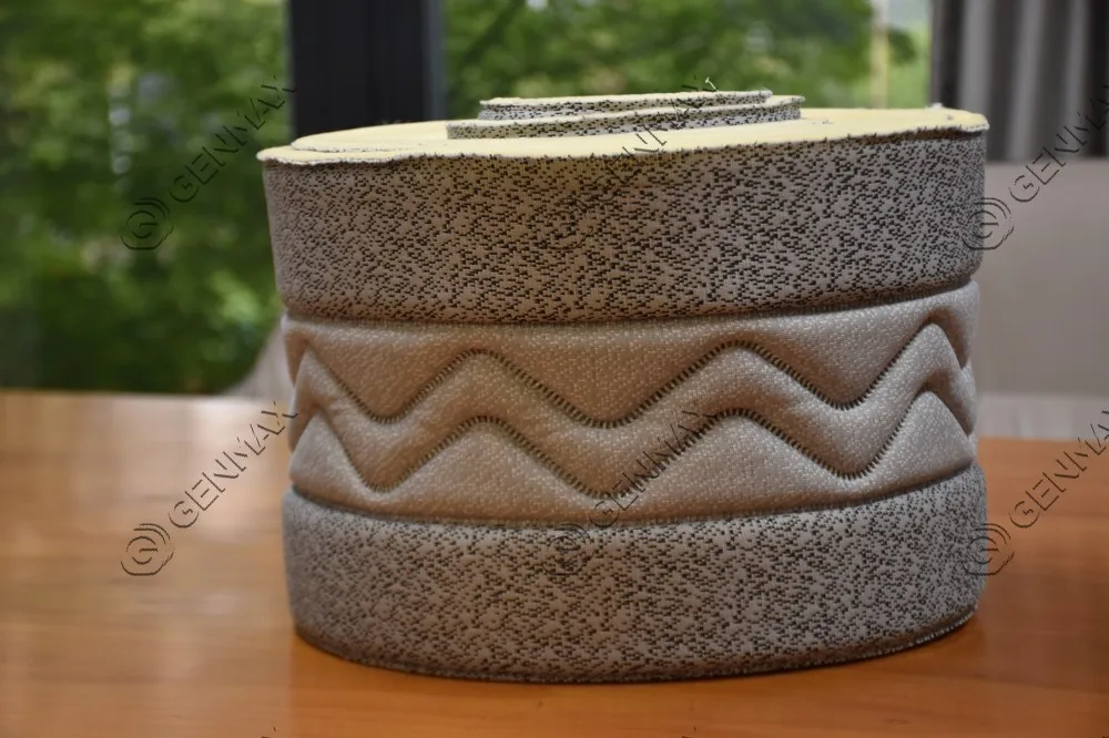 Grey beige mattress border fabric with horizontal chevron wave pattern produced by ultrasonic quilting machine