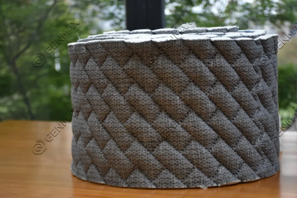 Grey mattress border fabric with large raised puffed diamond pattern produced by ultrasonic quilting machine
